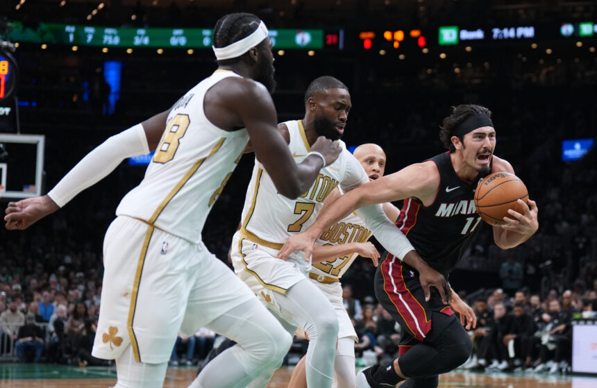 Dec 19, 2025; Boston, Massachusetts, USA; Miami Heat forward Jaime Jaquez Jr. (11) drives the ball against Boston Celtics guard Jaylen Brown (7) in the first quarter at TD Garden. Mandatory Credit: David Butler II-Imagn Images
