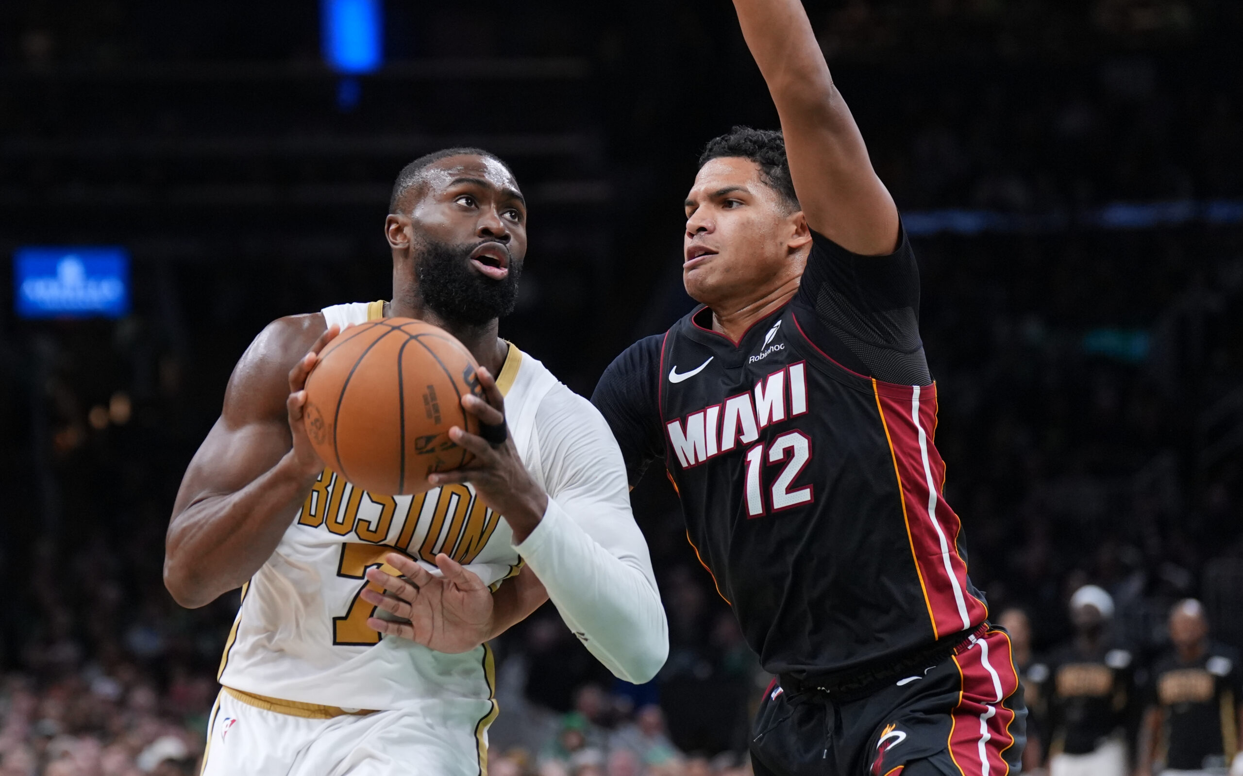 Dec 19, 2025; Boston, Massachusetts, USA; Boston Celtics guard Jaylen Brown (7) drives the ball against Miami Heat guard Dru Smith (12) in the second half at TD Garden. Mandatory Credit: David Butler II-Imagn Images