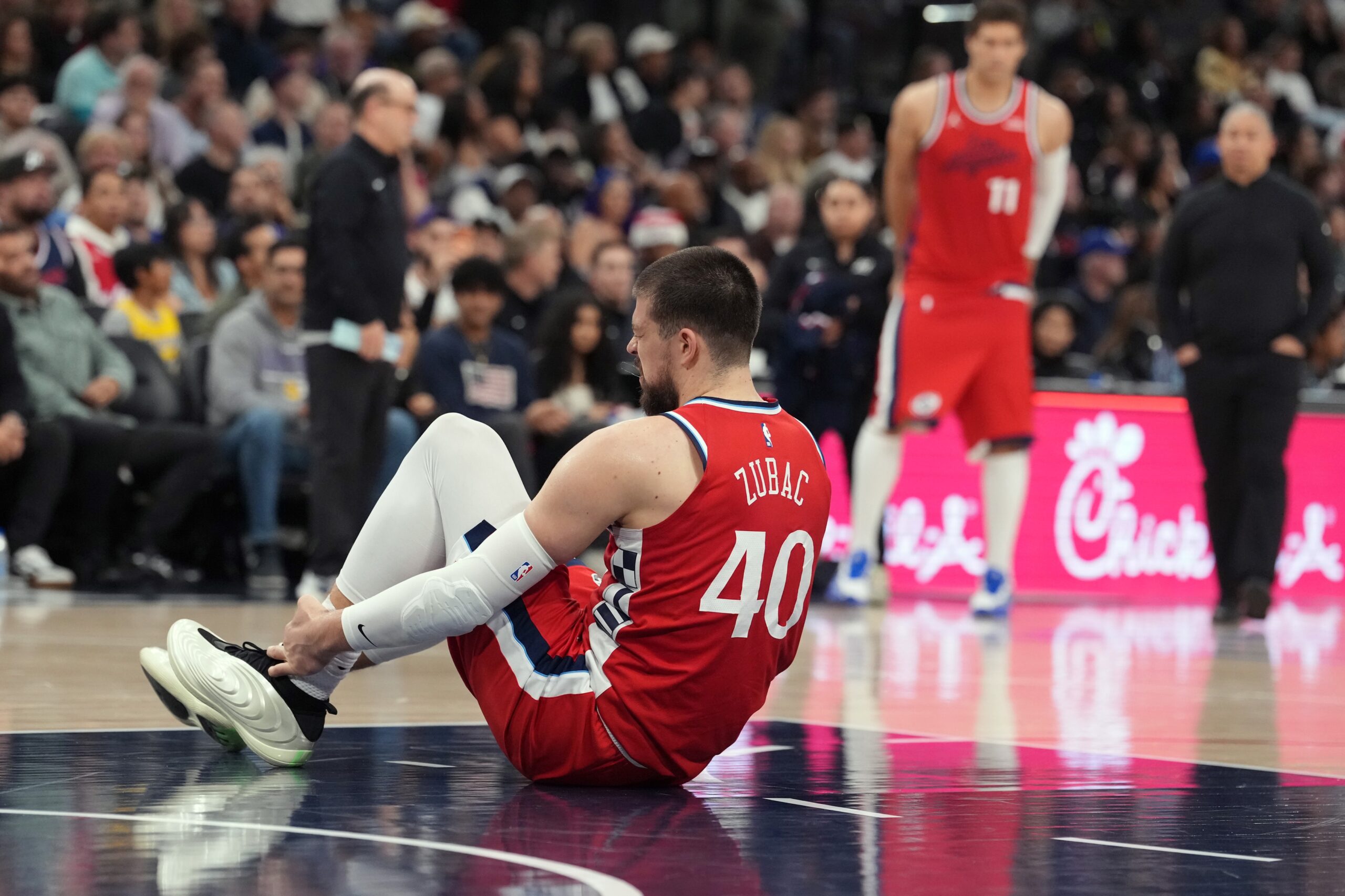 Dec 20, 2025; Inglewood, California, USA; LA Clippers center Ivica Zubac (40) suffers an injury against the Los Angeles Lakers in the first half at Intuit Dome. Mandatory Credit: Kirby Lee-Imagn Images