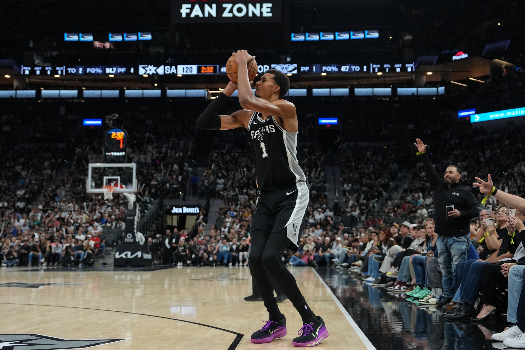 Nov 8, 2025; San Antonio, Texas, USA; San Antonio Spurs forward Victor Wembanyama (1) takes a three point shot in the second half against the New Orleans Pelicans at Frost Bank Center. Mandatory Credit: Daniel Dunn-Imagn Images