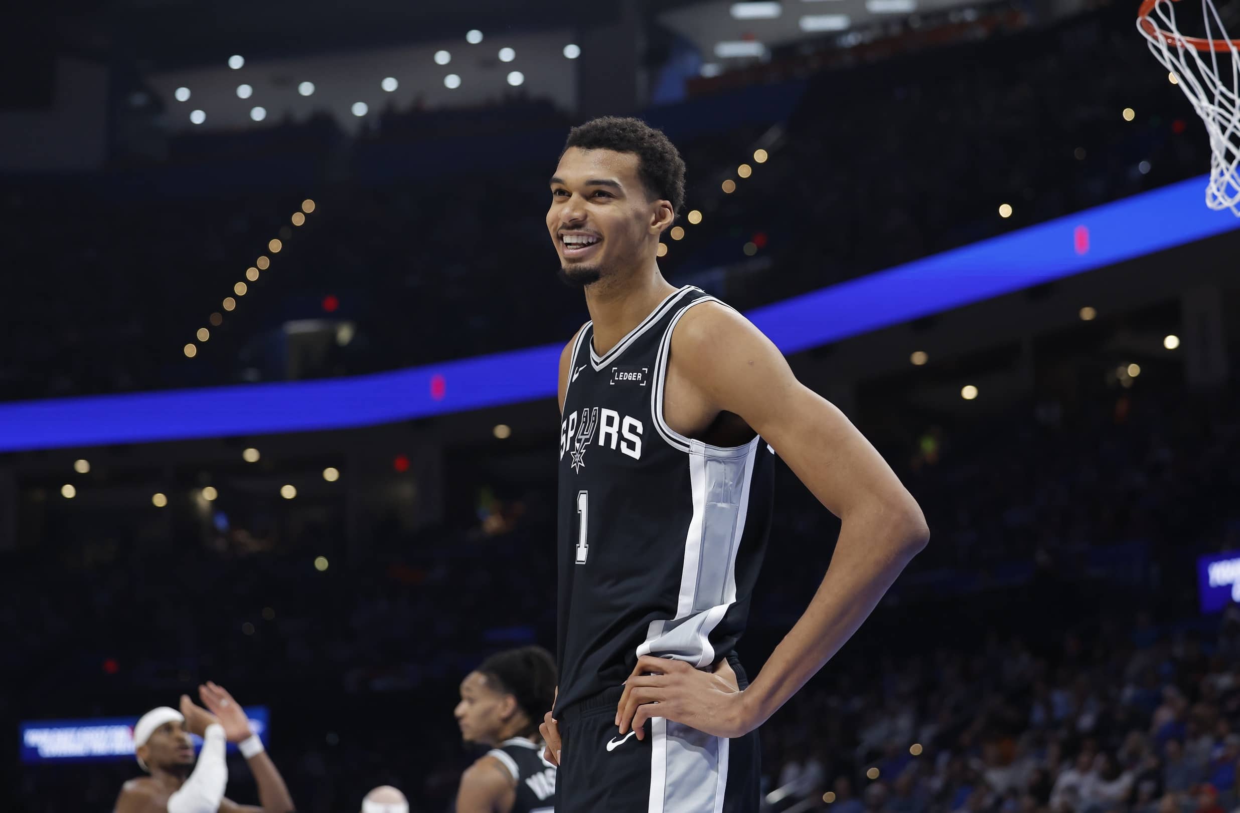 Oklahoma City, Oklahoma, USA; San Antonio Spurs forward Victor Wembanyama (1) smiles after a play against the Oklahoma City Thunder during the second half at Paycom Center. Mandatory Credit: Alonzo Adams-Imagn Images