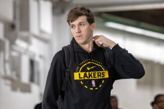 New Orleans, Louisiana, USA; Los Angeles Lakers guard Austin Reaves (15) arrives at the arena before the game against the New Orleans Pelicans at Smoothie King Center. Mandatory Credit: Stephen Lew-Imagn Images