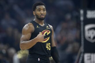 Cleveland, Ohio, USA; Cleveland Cavaliers guard Donovan Mitchell (45) stands on the court in the first quarter against the Charlotte Hornets at Rocket Arena. Mandatory Credit: David Richard-Imagn Images