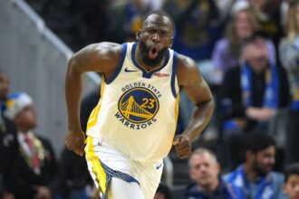 San Francisco, California, USA; Golden State Warriors forward Draymond Green (23) reacts after making a three point basket against the Dallas Mavericks during the second quarter at Chase Center. Mandatory Credit: Darren Yamashita-Imagn Images