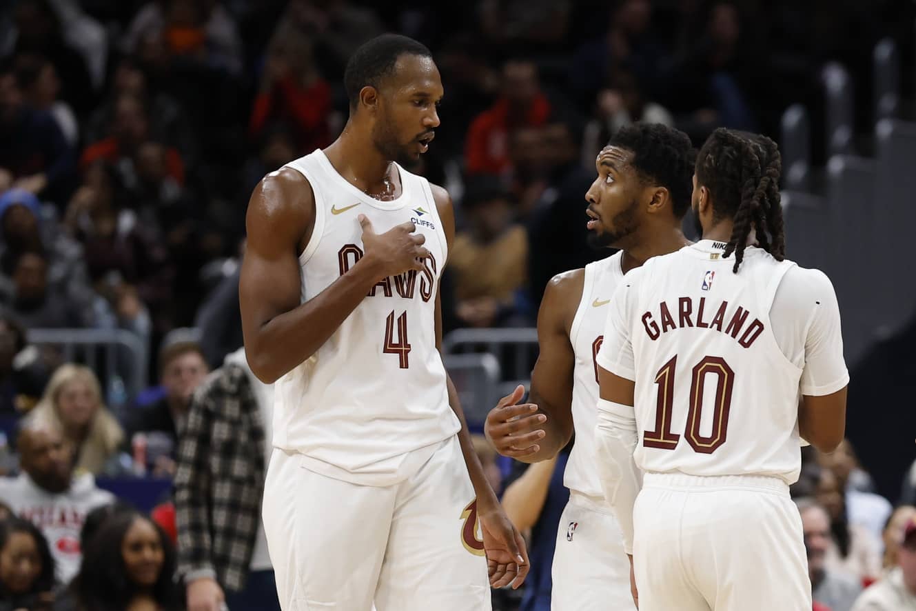 Washington, District of Columbia, USA; Cleveland Cavaliers guard Donovan Mitchell (45) talks with Cavaliers center Evan Mobley (4) and Cavaliers guard Darius Garland (10) during a stoppage in play against the Washington Wizards in the second half at Capital One Arena. Mandatory Credit: Geoff Burke-Imagn Images