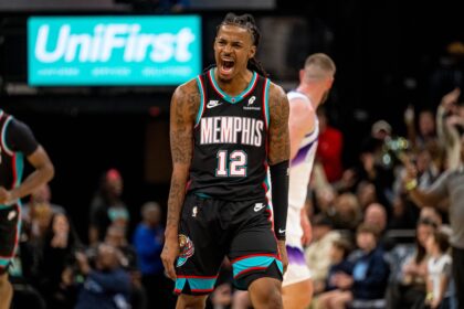 Memphis, Tennessee, USA; Memphis Grizzlies point guard Ja Morant (12) celebrates after making a three-pointer in the second half against the Utah Jazz at FedExForum. Mandatory Credit: Matthew Smith-Imagn Images