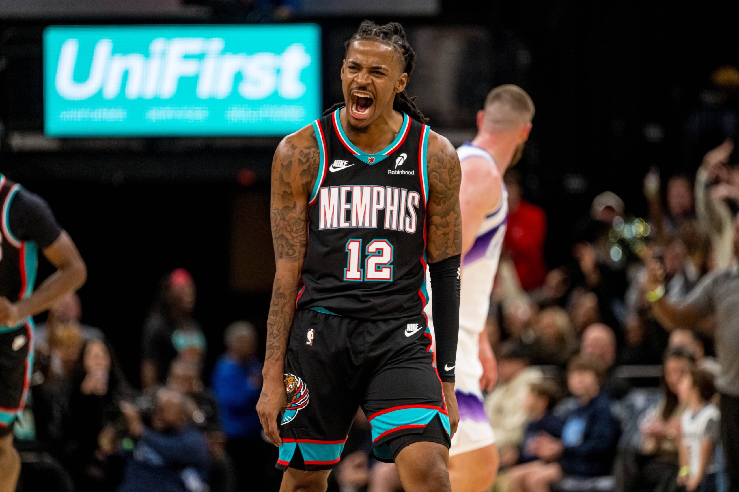 Memphis, Tennessee, USA; Memphis Grizzlies point guard Ja Morant (12) celebrates after making a three-pointer in the second half against the Utah Jazz at FedExForum. Mandatory Credit: Matthew Smith-Imagn Images