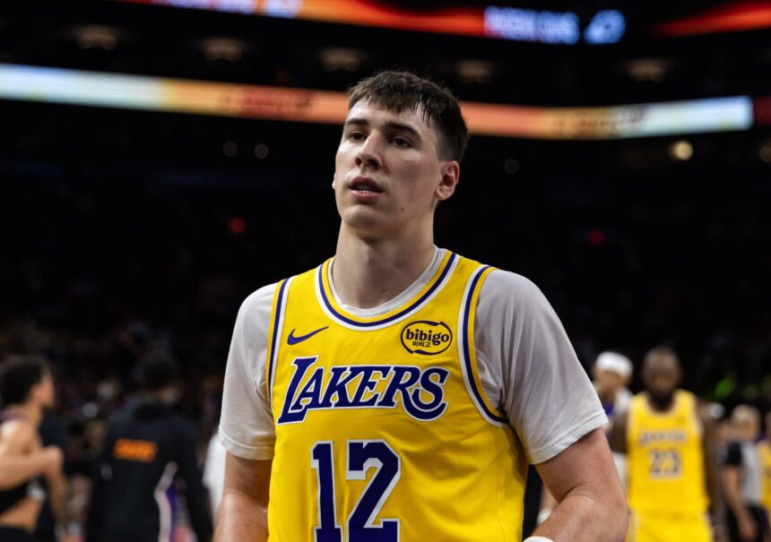 Phoenix, Arizona, USA; Los Angeles Lakers forward Jake LaRavia (12) against the Phoenix Suns at Mortgage Matchup Center. Mandatory Credit: Mark J. Rebilas-Imagn Images
