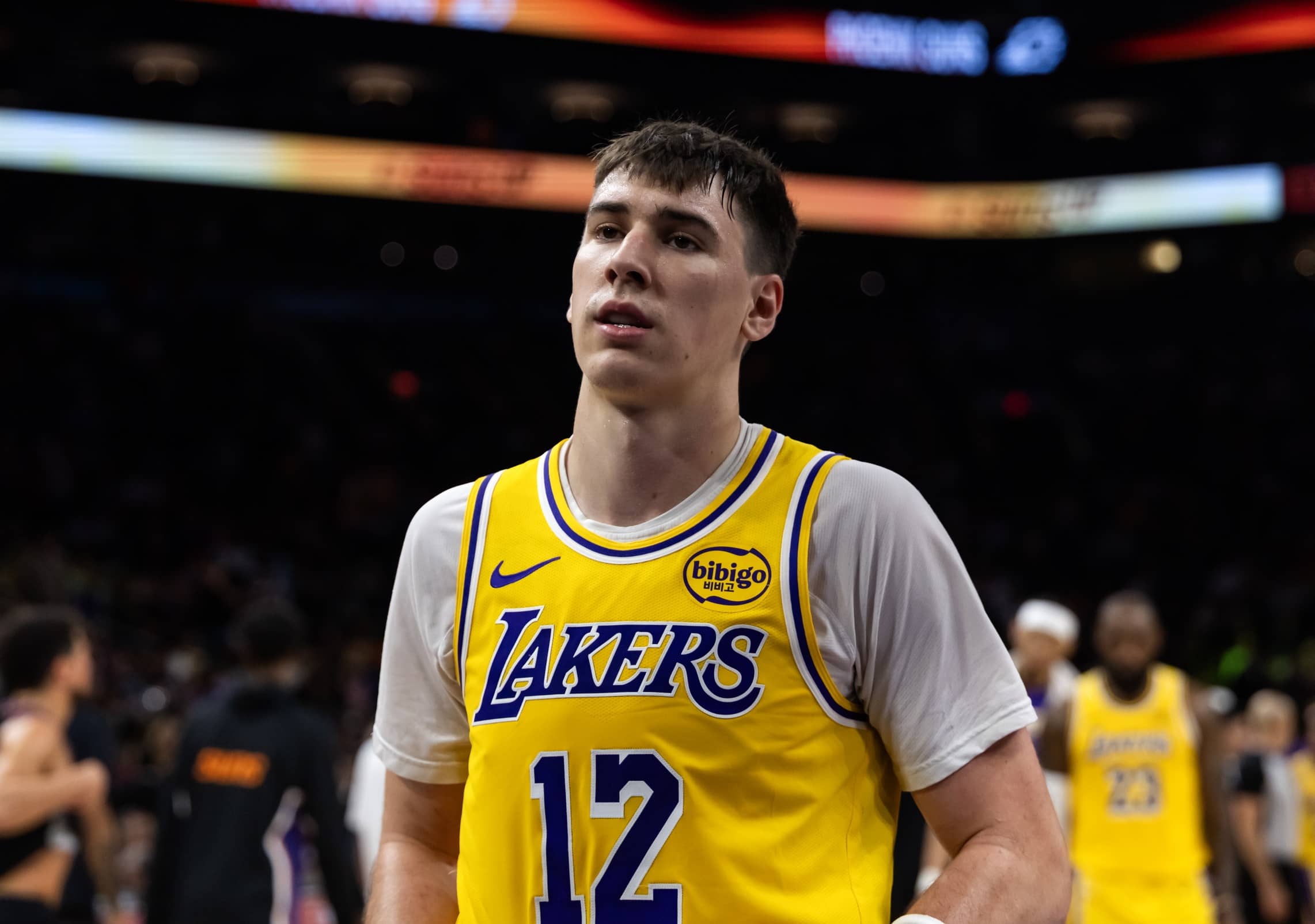 Phoenix, Arizona, USA; Los Angeles Lakers forward Jake LaRavia (12) against the Phoenix Suns at Mortgage Matchup Center. Mandatory Credit: Mark J. Rebilas-Imagn Images
