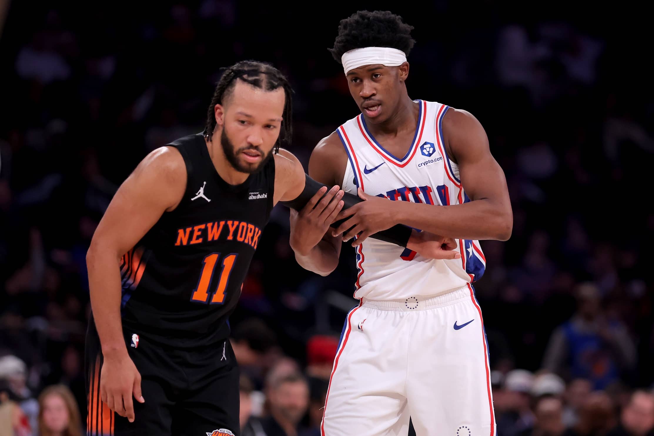New York, New York, USA; New York Knicks guard Jalen Brunson (11) defends Philadelphia 76ers guard VJ Edgecombe (77) during the third quarter at Madison Square Garden. Mandatory Credit: Brad Penner-Imagn Images