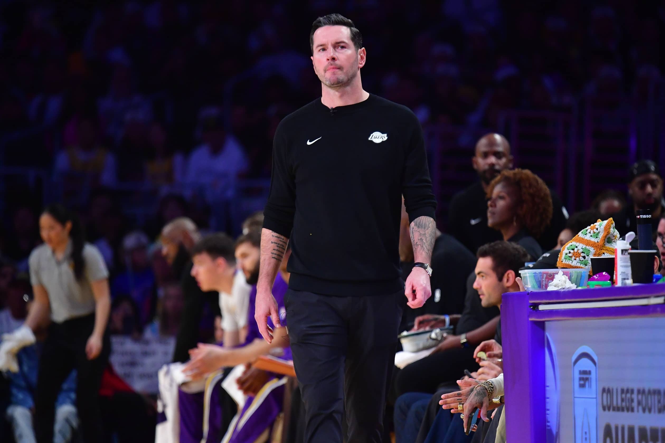 Los Angeles, California, USA; Los Angeles Lakers head coach JJ Redick watches game action against the Houston Rockets during the first half at Crypto.com Arena. Mandatory Credit: Gary A. Vasquez-Imagn Images