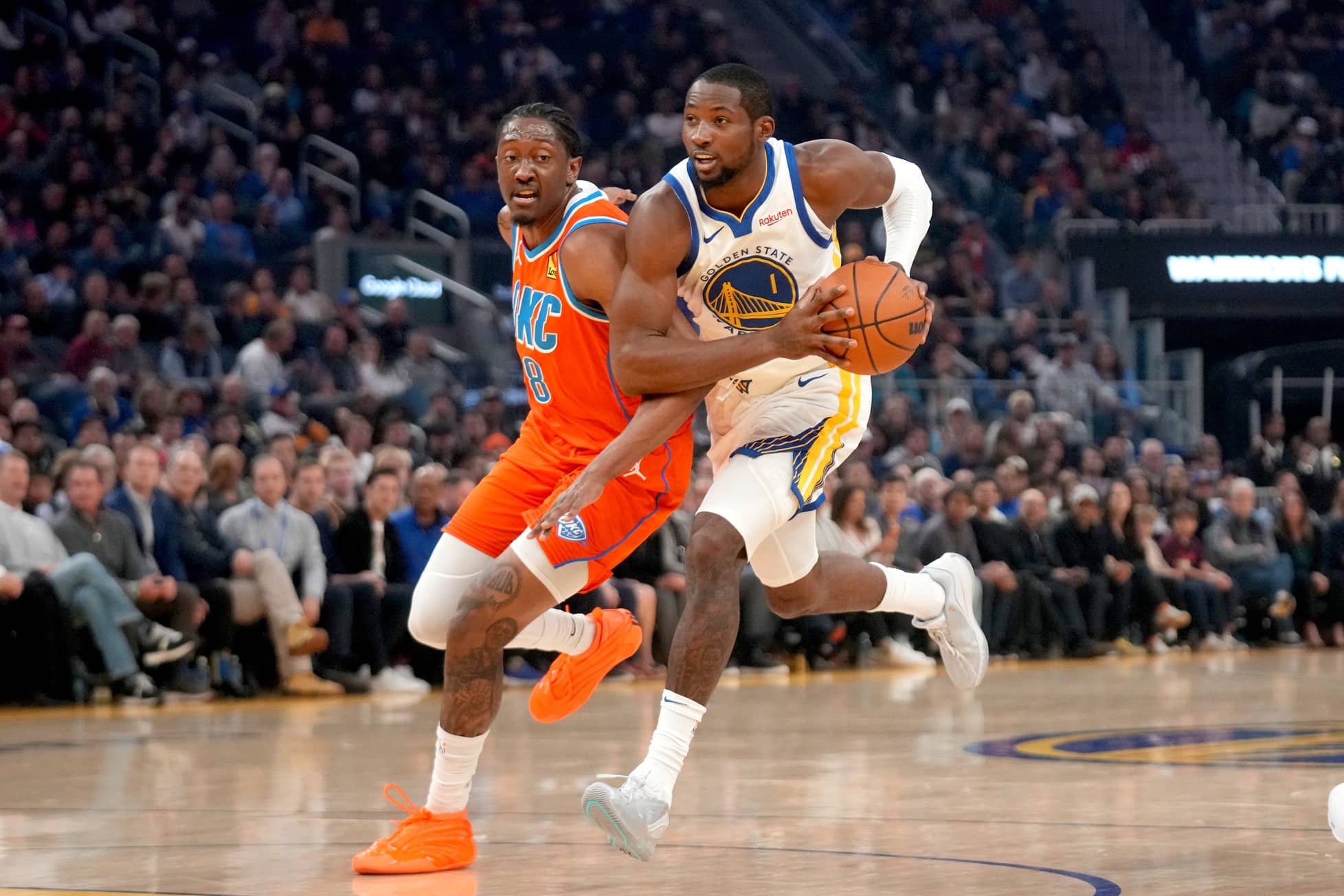 San Francisco, California, USA; Golden State Warriors forward Jonathan Kuminga (1) drives past Oklahoma City Thunder guard Jalen Williams (8) in the first quarter at the Chase Center. Mandatory Credit: Cary Edmondson-Imagn Images