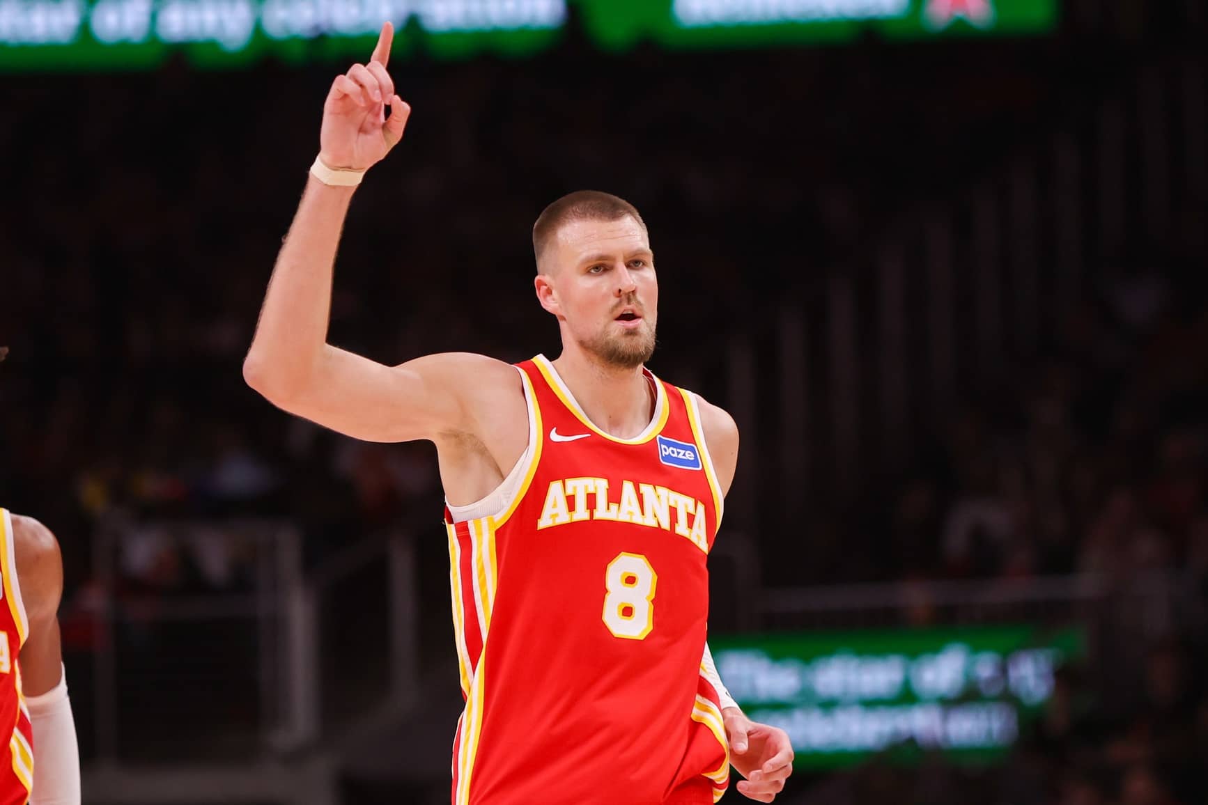 Atlanta, Georgia, USA; Atlanta Hawks center Kristaps Porzingis (8) reacts after a basket against the Toronto Raptors in the second quarter at State Farm Arena. Mandatory Credit: Brett Davis-Imagn Images
