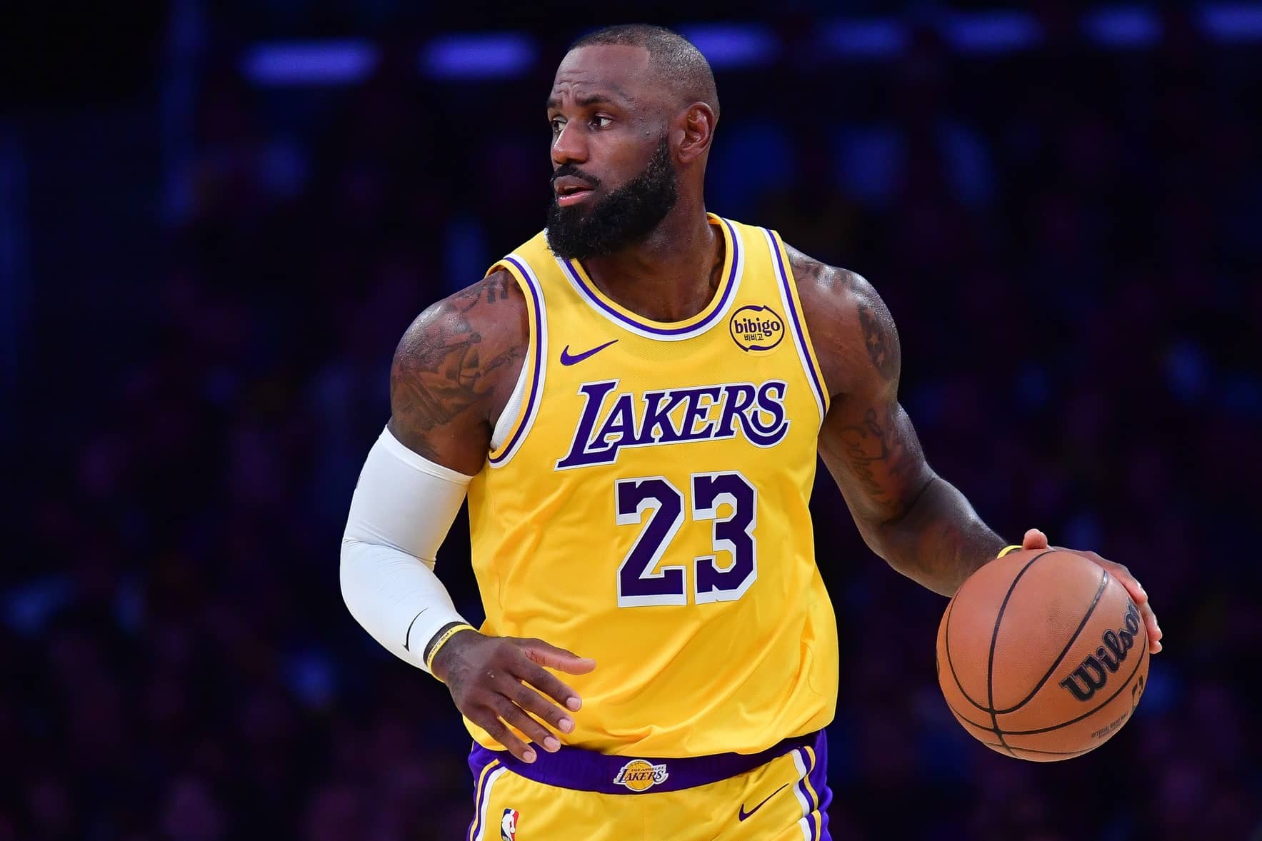 Los Angeles, California, USA; Los Angeles Lakers forward LeBron James (23) brings the ball up court against the Phoenix Suns during the second half at Crypto.com Arena. Mandatory Credit: Gary A. Vasquez-Imagn Images
