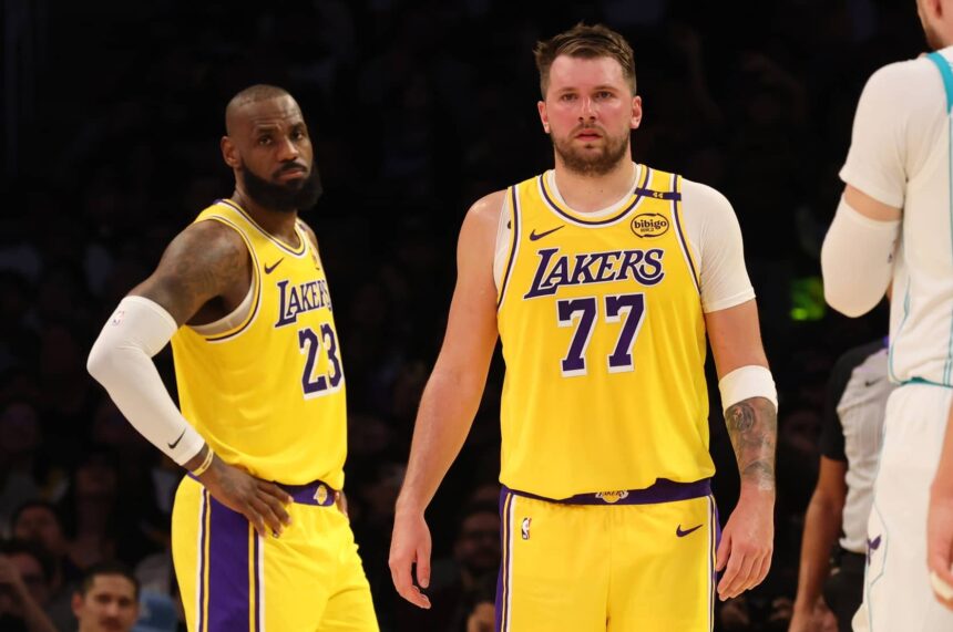 Los Angeles, California, USA; Los Angeles Lakers forward LeBron James (23) and guard Luka Doncic (77) during the second quarter against the Charlotte Hornets at Crypto.com Arena. Mandatory Credit: Jason Parkhurst-Imagn Images