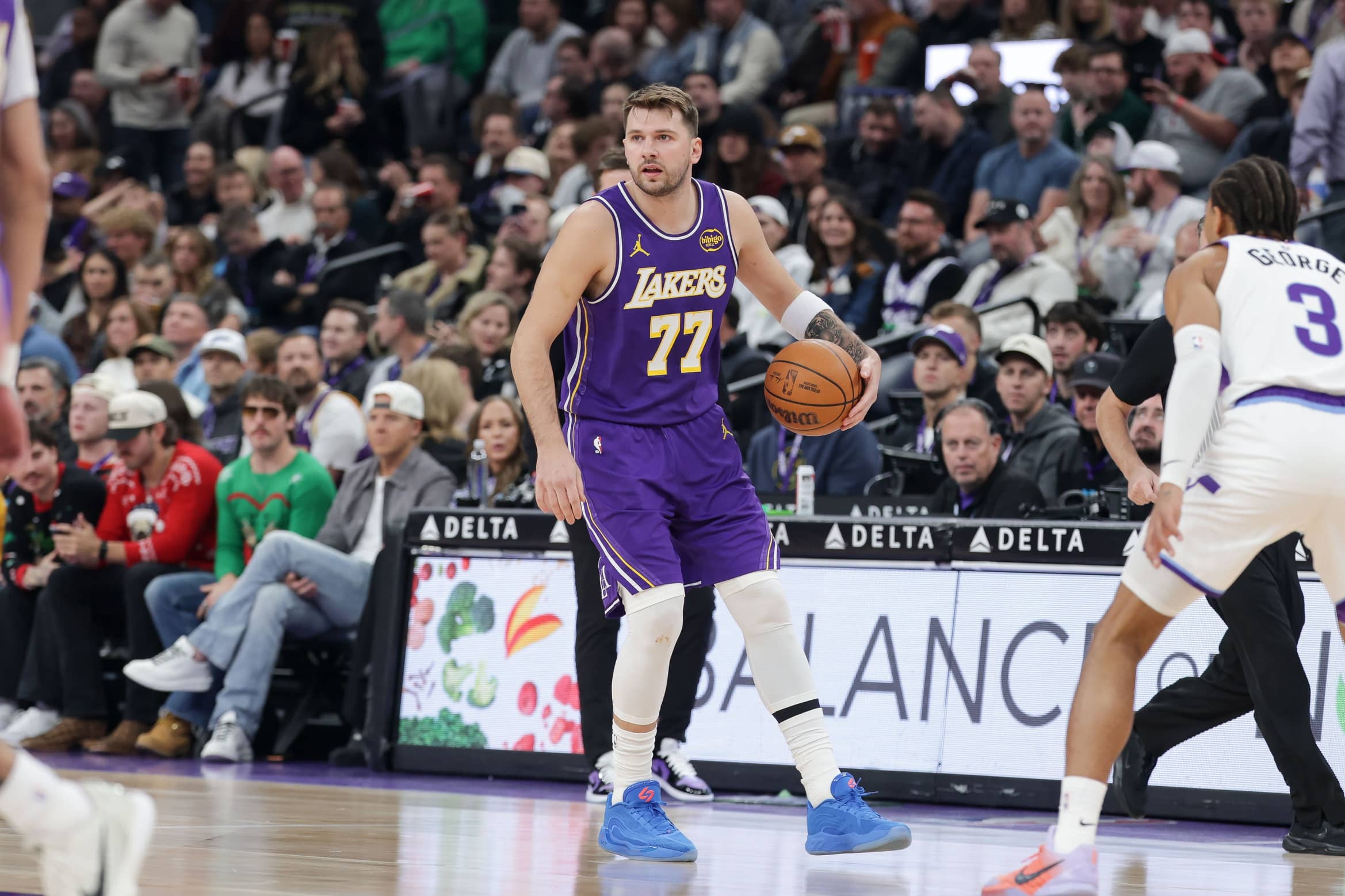 Salt Lake City, Utah, USA; Los Angeles Lakers forward/guard Luka Doncic (77) dribbles during the first quarter against the Utah Jazz at Delta Center. Mandatory Credit: Chris Nicoll-Imagn Images