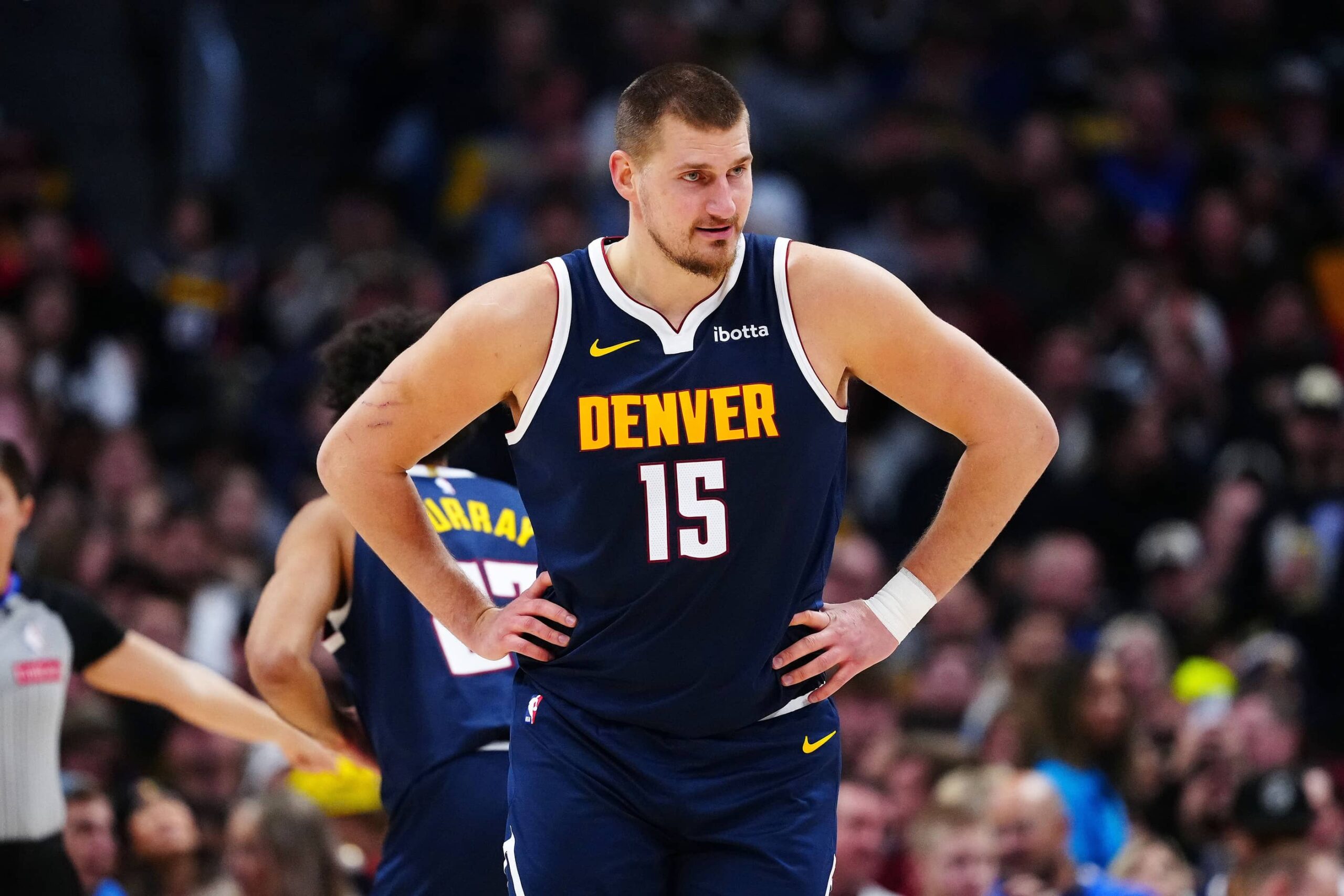 Denver, Colorado, USA; Denver Nuggets center Nikola Jokic (15) reacts in the second quarter against the Houston Rockets at Ball Arena. Mandatory Credit: Ron Chenoy-Imagn Images