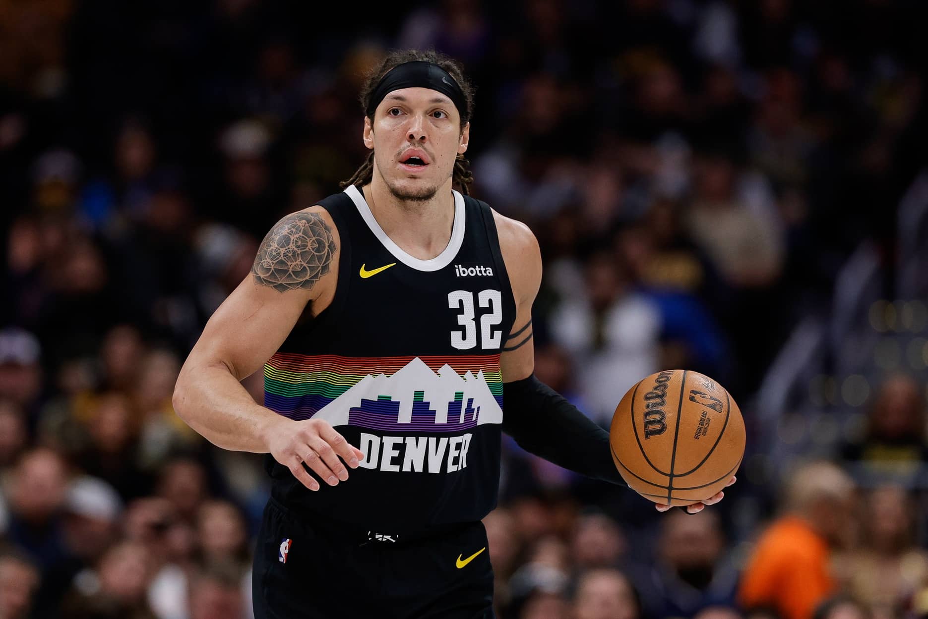 Jan 17, 2026; Denver, Colorado, USA; Denver Nuggets forward Aaron Gordon (32) dribbles the ball up court in the first quarter against the Washington Wizards at Ball Arena. Mandatory Credit: Isaiah J. Downing-Imagn Images