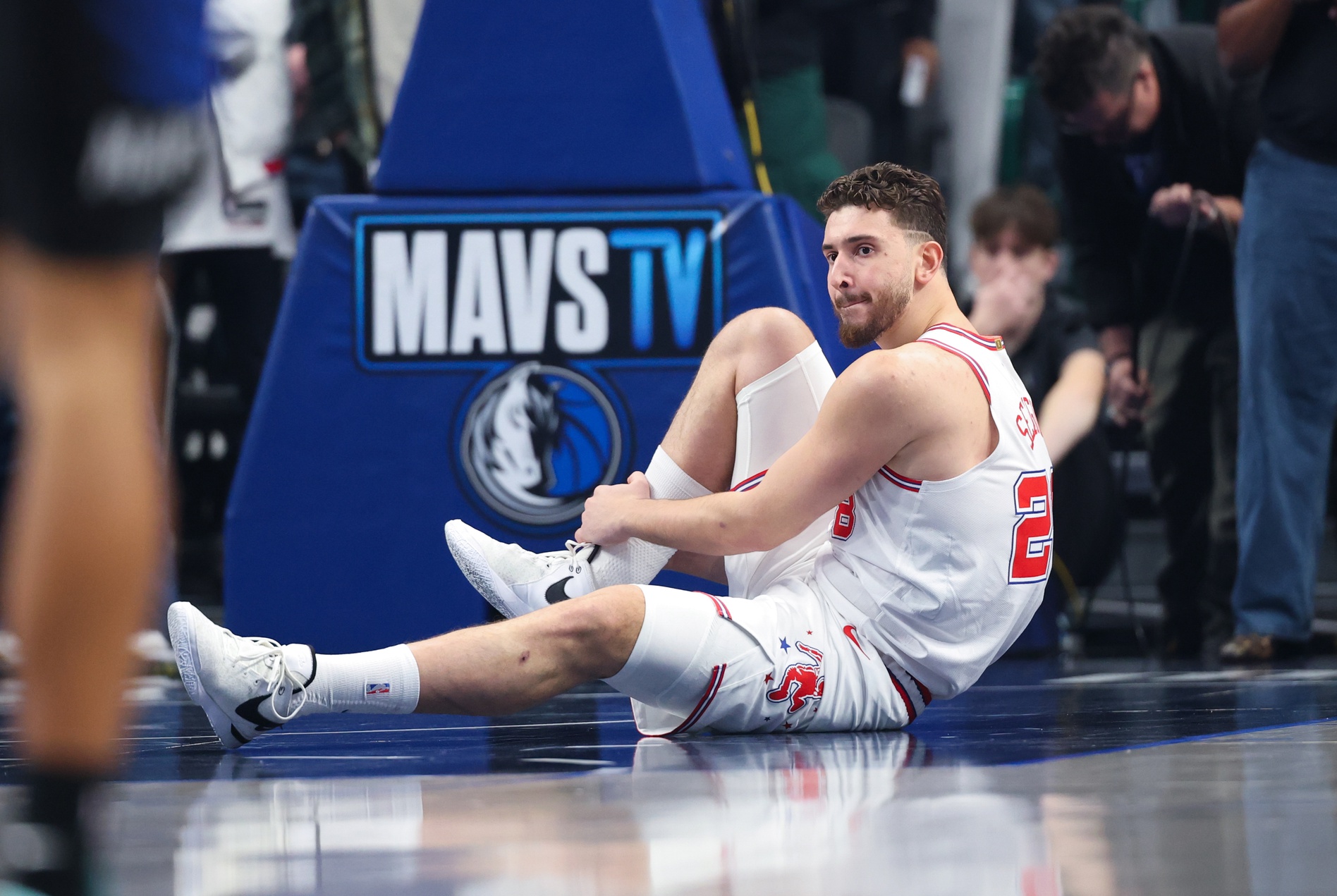 Jan 3, 2026; Dallas, Texas, USA; Houston Rockets center Alperen Sengun (28) lays injured during the first quarter against the Dallas Mavericks at American Airlines Center. Mandatory Credit: Kevin Jairaj-Imagn Images