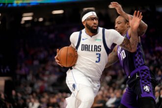 Jan 6, 2026; Sacramento, California, USA; Dallas Mavericks forward Anthony Davis (3) drives past Sacramento Kings guard DeMar DeRozan (10) in the first quarter at the Golden 1 Center. Mandatory Credit: Cary Edmondson-Imagn Images