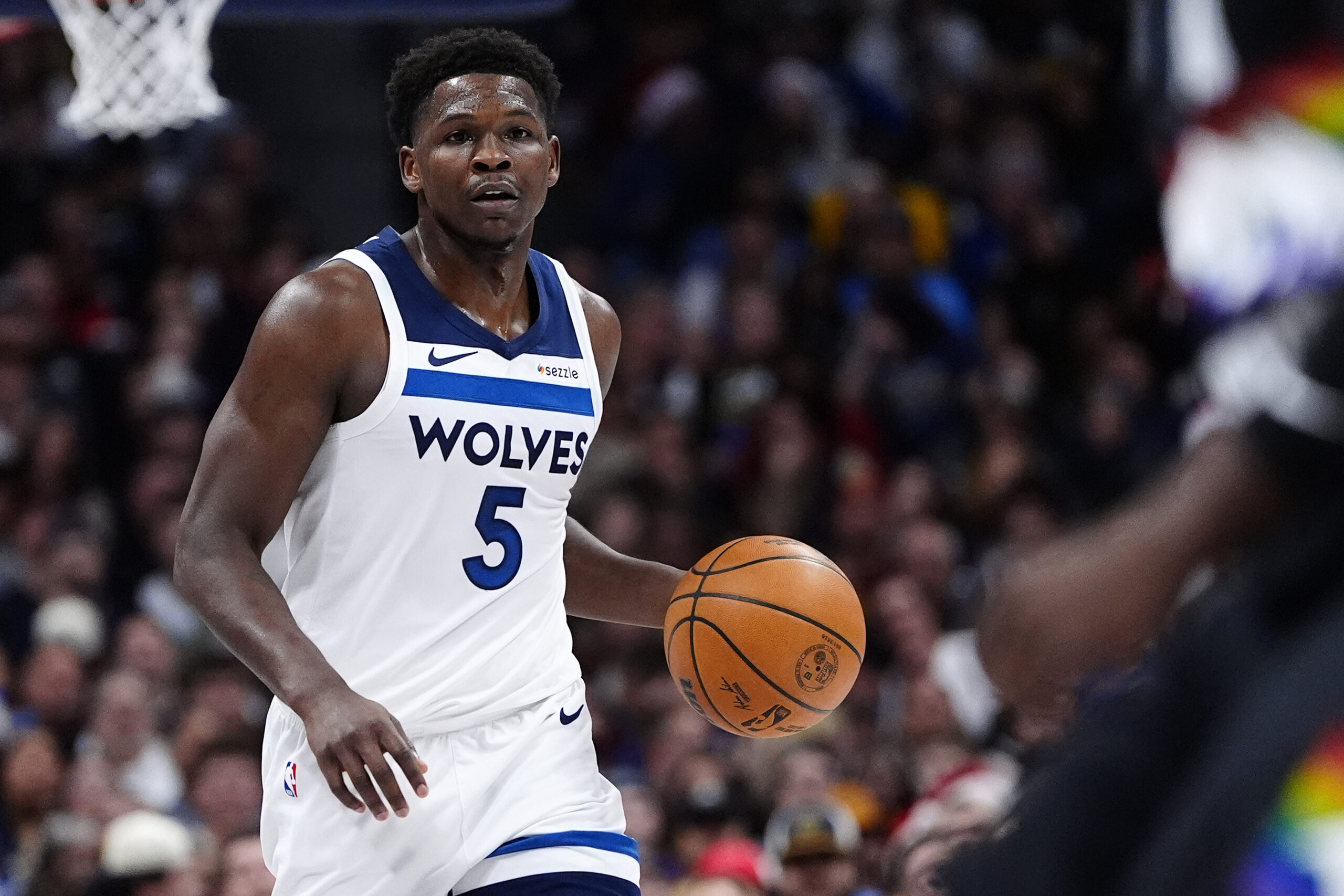 Dec 25, 2025; Denver, Colorado, USA; Minnesota Timberwolves guard Anthony Edwards (5) dribbles the ball against the Denver Nuggets during the first half at Ball Arena. Mandatory Credit: Ron Chenoy-Imagn Images