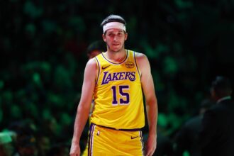 Los Angeles Lakers guard Austin Reaves (15) against the Phoenix Suns at Mortgage Matchup Center.
