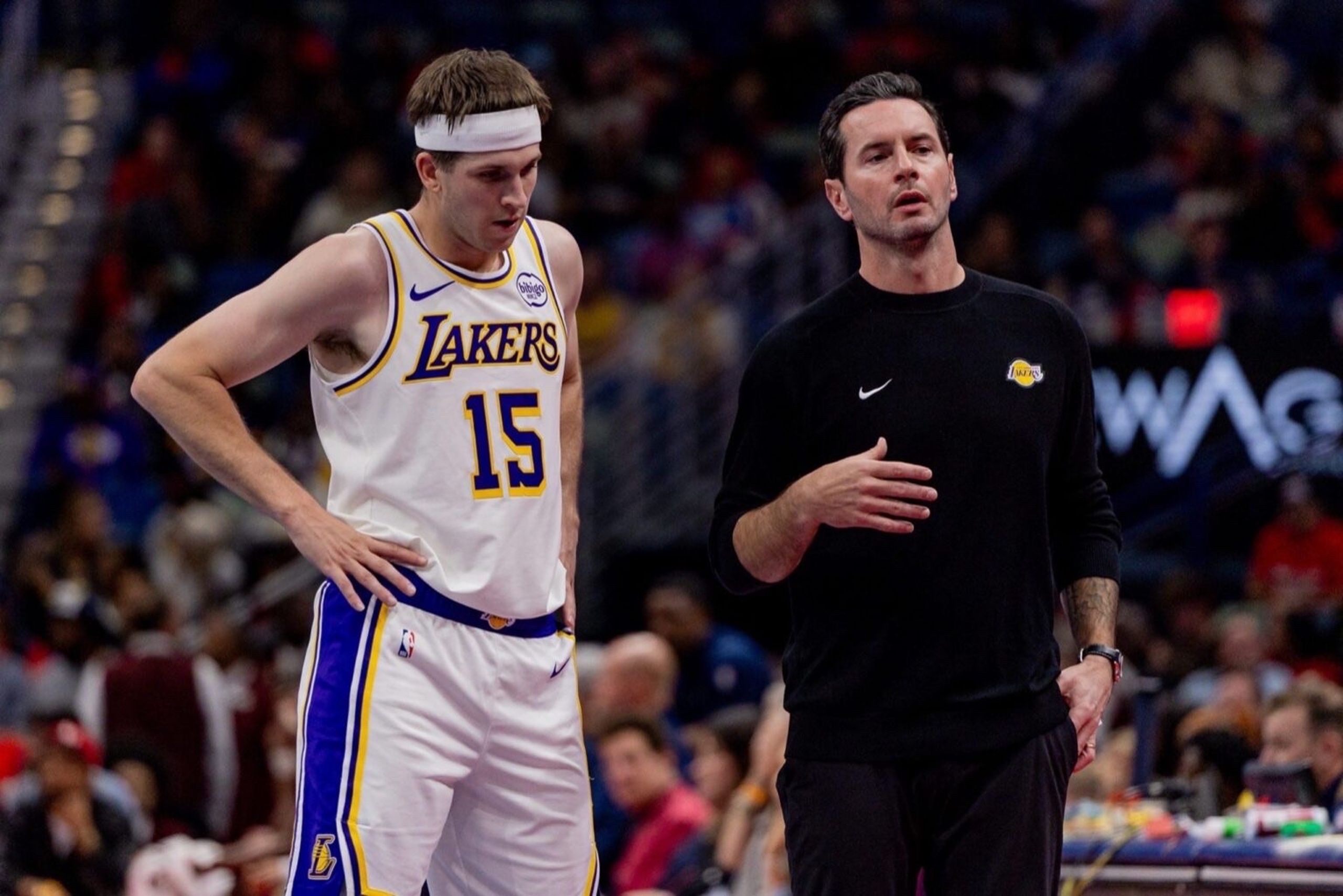 Nov 14, 2025; New Orleans, Louisiana, USA; Los Angeles Lakers guard Austin Reaves (15) talks to Head Coach JJ Redick on a time out against the New Orleans Pelicans during the first half at Smoothie King Center. Mandatory Credit: Stephen Lew-Imagn Images
