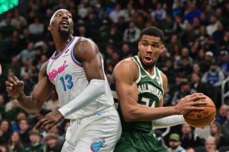 Milwaukee, Wisconsin, USA; Milwaukee Bucks forward Giannis Antetokounmpo (34) looks for a shot against Miami Heat center Bam Adebayo (13) in the second quarter at Fiserv Forum. Mandatory Credit: Benny Sieu-Imagn Images