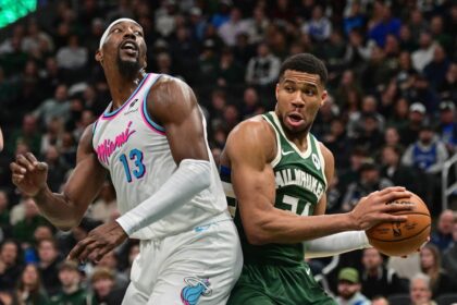 Milwaukee, Wisconsin, USA; Milwaukee Bucks forward Giannis Antetokounmpo (34) looks for a shot against Miami Heat center Bam Adebayo (13) in the second quarter at Fiserv Forum. Mandatory Credit: Benny Sieu-Imagn Images