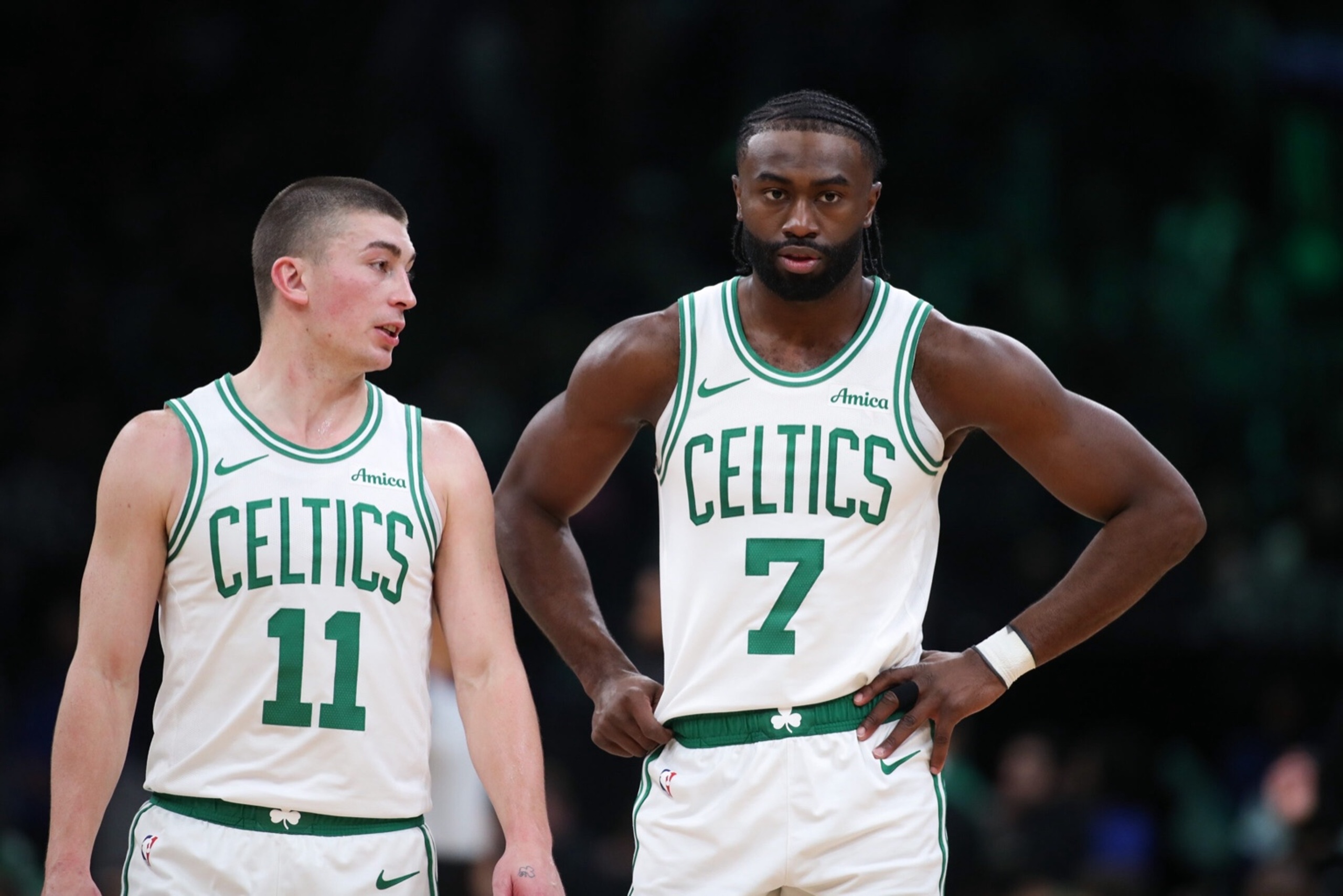 Dec 7, 2024; Boston, Massachusetts, USA; Boston Celtics forward Jaylen Brown (7) and Boston Celtics guard Payton Pritchard (11) talk during the first half against the Memphis Grizzlies at TD Garden. Mandatory Credit: Paul Rutherford-Imagn Images