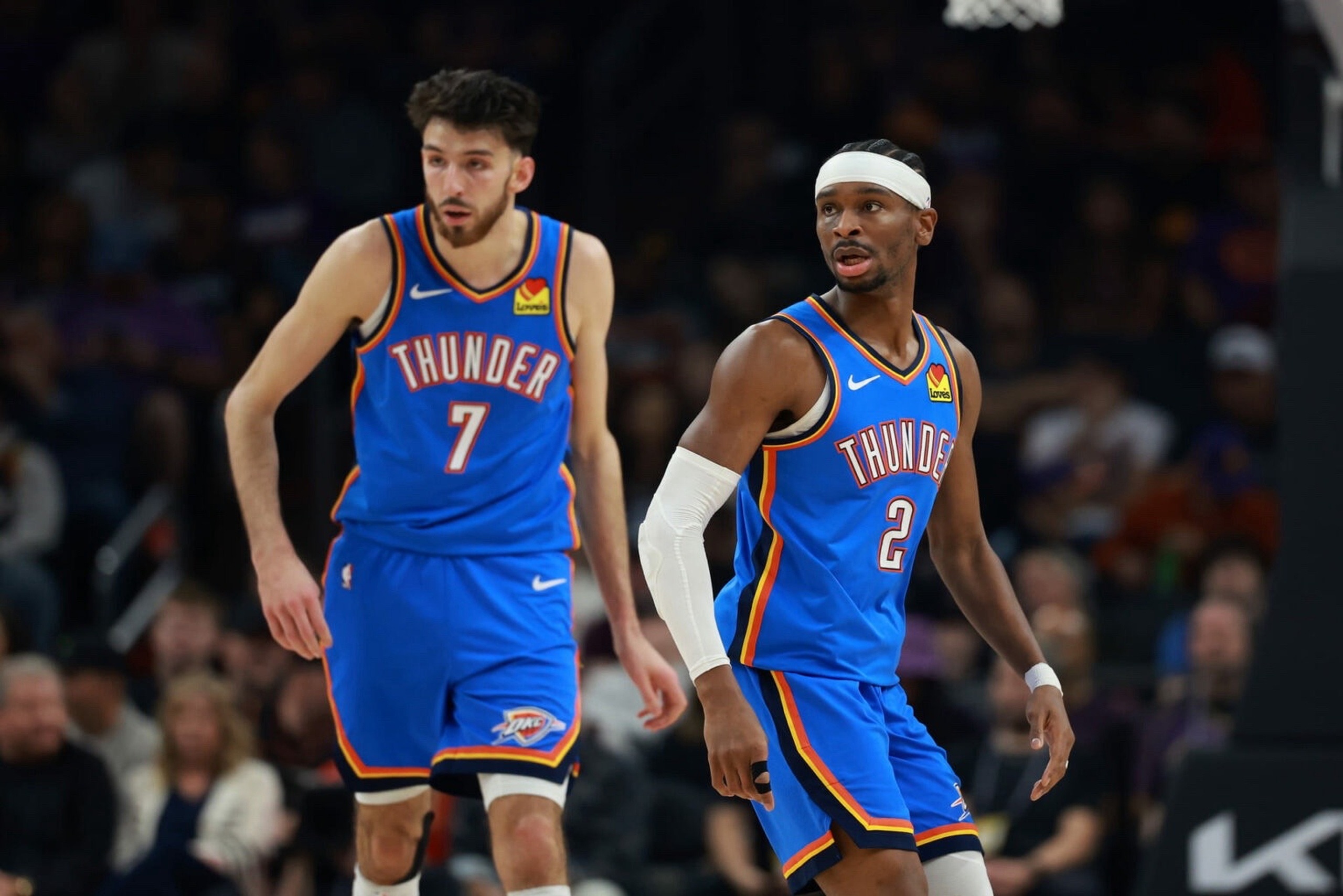 Phoenix, Arizona, USA; Oklahoma City Thunder guard Shai Gilgeous-Alexander (2) and center Chet Holmgren (7) against the Phoenix Suns at Mortgage Matchup Center. Mandatory Credit: Mark J. Rebilas-Imagn Images