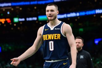 Denver Nuggets guard Christian Braun (0) reacts after a play during the second half against the Boston Celtics at TD Garden. Mandatory Credit: Bob DeChiara-Imagn Images