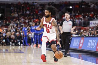 Jan 10, 2026; Chicago, Illinois, USA; Chicago Bulls guard Coby White (0) brings the ball up court against the Dallas Mavericks during the first half at United Center. Mandatory Credit: Kamil Krzaczynski-Imagn Images