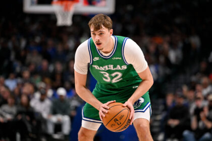 Jan 12, 2026; Dallas, Texas, USA; Dallas Mavericks forward Cooper Flagg (32) looks to move the ball against the Brooklyn Nets during the second quarter at the American Airlines Center. Mandatory Credit: Jerome Miron-Imagn Images