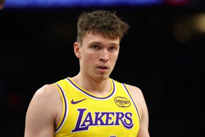 Dec 23, 2025; Phoenix, Arizona, USA; Los Angeles Lakers forward Dalton Knecht (4) against the Phoenix Suns at Mortgage Matchup Center. Mandatory Credit: Mark J. Rebilas-Imagn Images