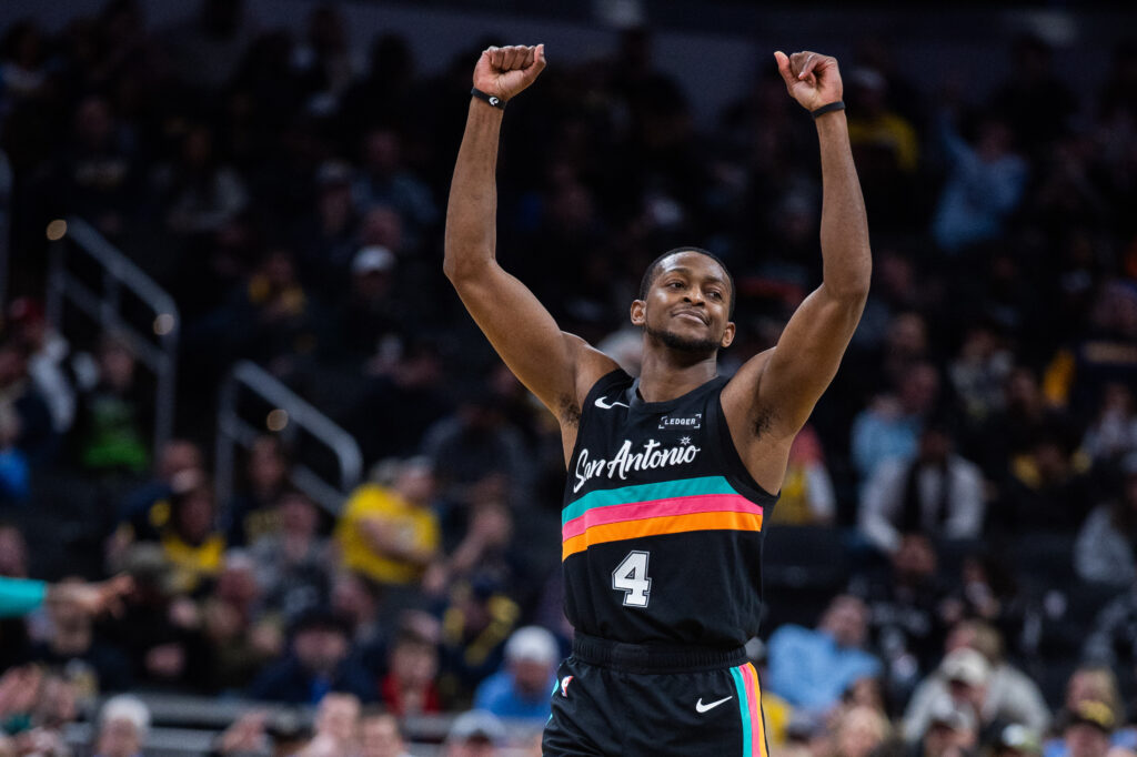 Jan 2, 2026; Indianapolis, Indiana, USA; San Antonio Spurs guard De'Aaron Fox (4) celebrates a made basket in the second half against the Indiana Pacers at Gainbridge Fieldhouse. Mandatory Credit: Trevor Ruszkowski-Imagn Images