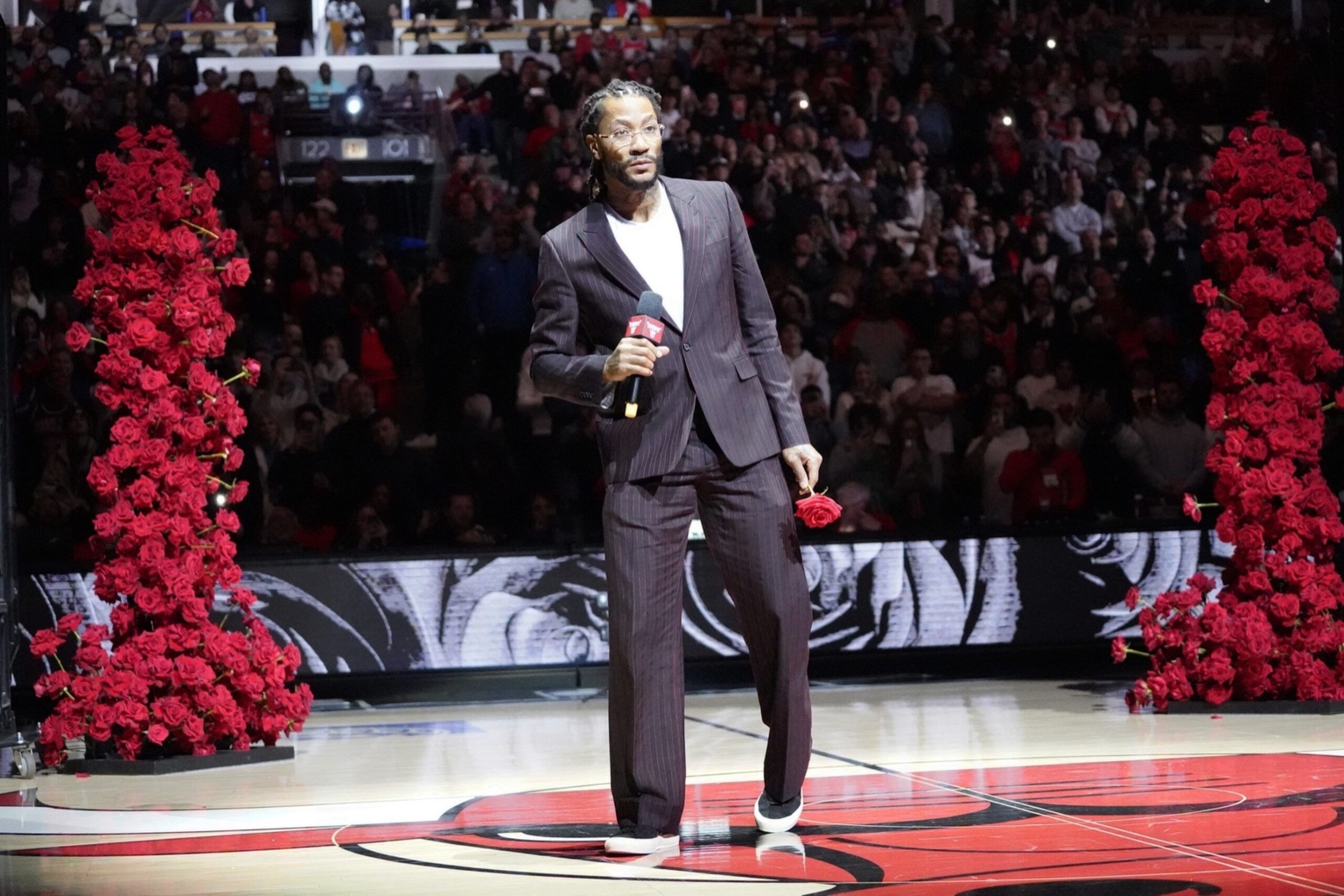 Jan 4, 2025; Chicago, Illinois, USA; Chicago Bulls and New York Knicks former player Derrick Rose speaks as he is honored at halftime of a game between the Chicago Bulls and the New York Knicks at United Center. Mandatory Credit: David Banks-Imagn Images