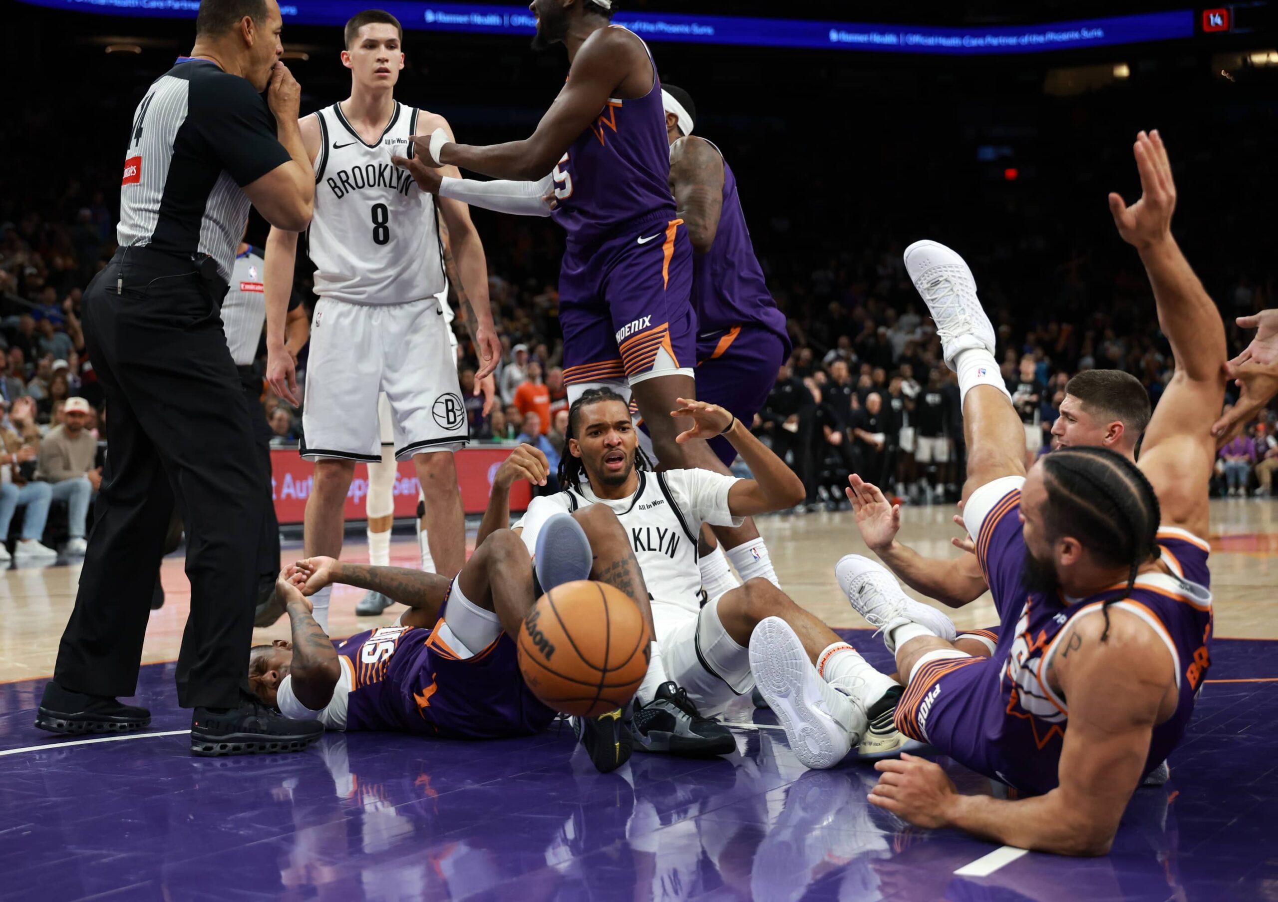 Jan 27, 2026; Phoenix, Arizona, USA; Brooklyn Nets guard Egor Demin (8) reacts after pushing Phoenix Suns forward Dillon Brooks to the ground to start a fight in the second half at Mortgage Matchup Center. Mandatory Credit: Mark J. Rebilas-Imagn Images