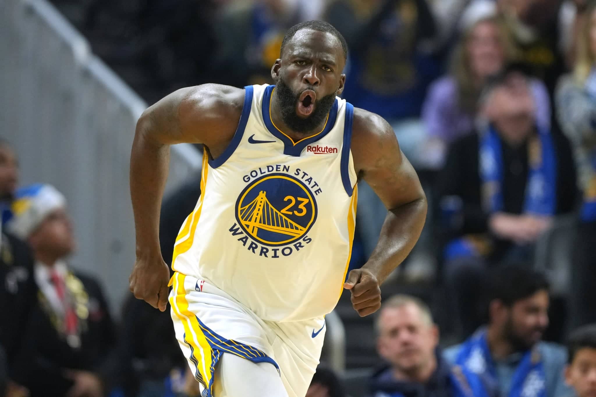 Golden State Warriors forward Draymond Green (23) reacts after making a three point basket against the Dallas Mavericks during the second quarter at Chase Center.