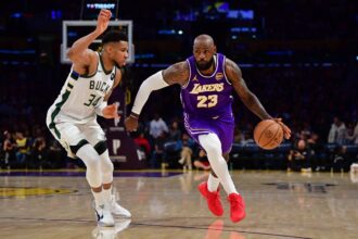 Los Angeles Lakers forward LeBron James (23) moves the ball against Milwaukee Bucks forward Giannis Antetokounmpo (34) during the second half at Crypto.com Arena.