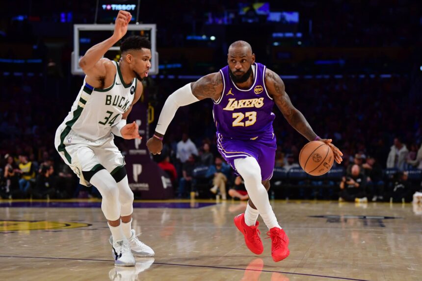 Los Angeles Lakers forward LeBron James (23) moves the ball against Milwaukee Bucks forward Giannis Antetokounmpo (34) during the second half at Crypto.com Arena.