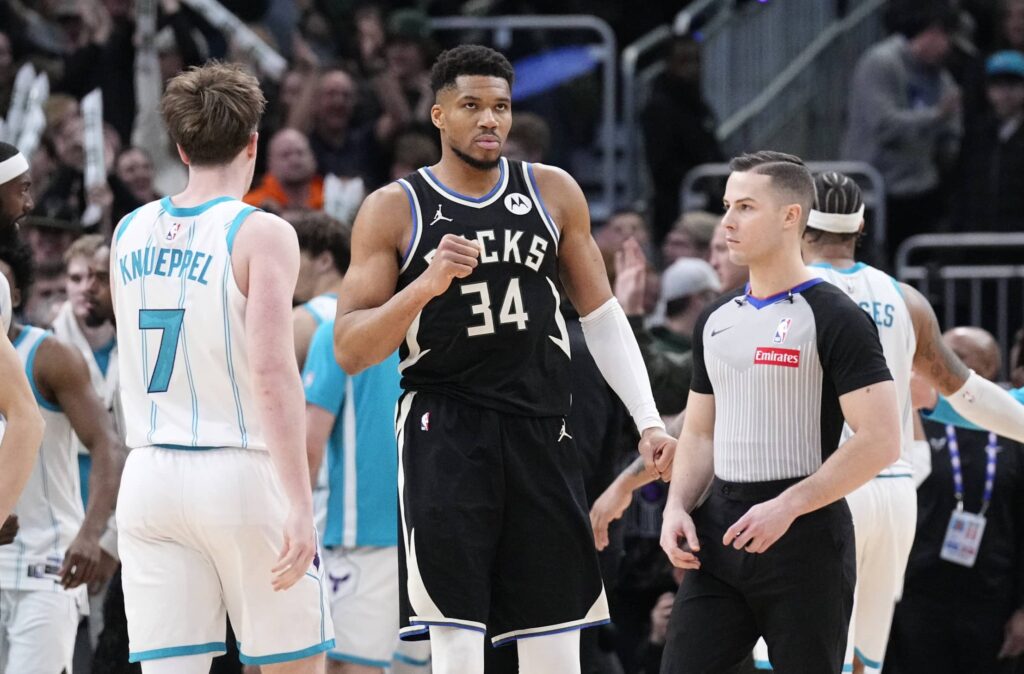 Milwaukee Bucks forward Giannis Antetokounmpo (34) celebrates a 122-121 win over the Charlotte Hornets at Fiserv Forum.