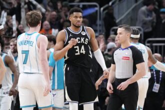 Milwaukee Bucks forward Giannis Antetokounmpo (34) celebrates a 122-121 win over the Charlotte Hornets at Fiserv Forum.