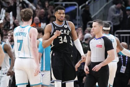 Milwaukee Bucks forward Giannis Antetokounmpo (34) celebrates a 122-121 win over the Charlotte Hornets at Fiserv Forum.