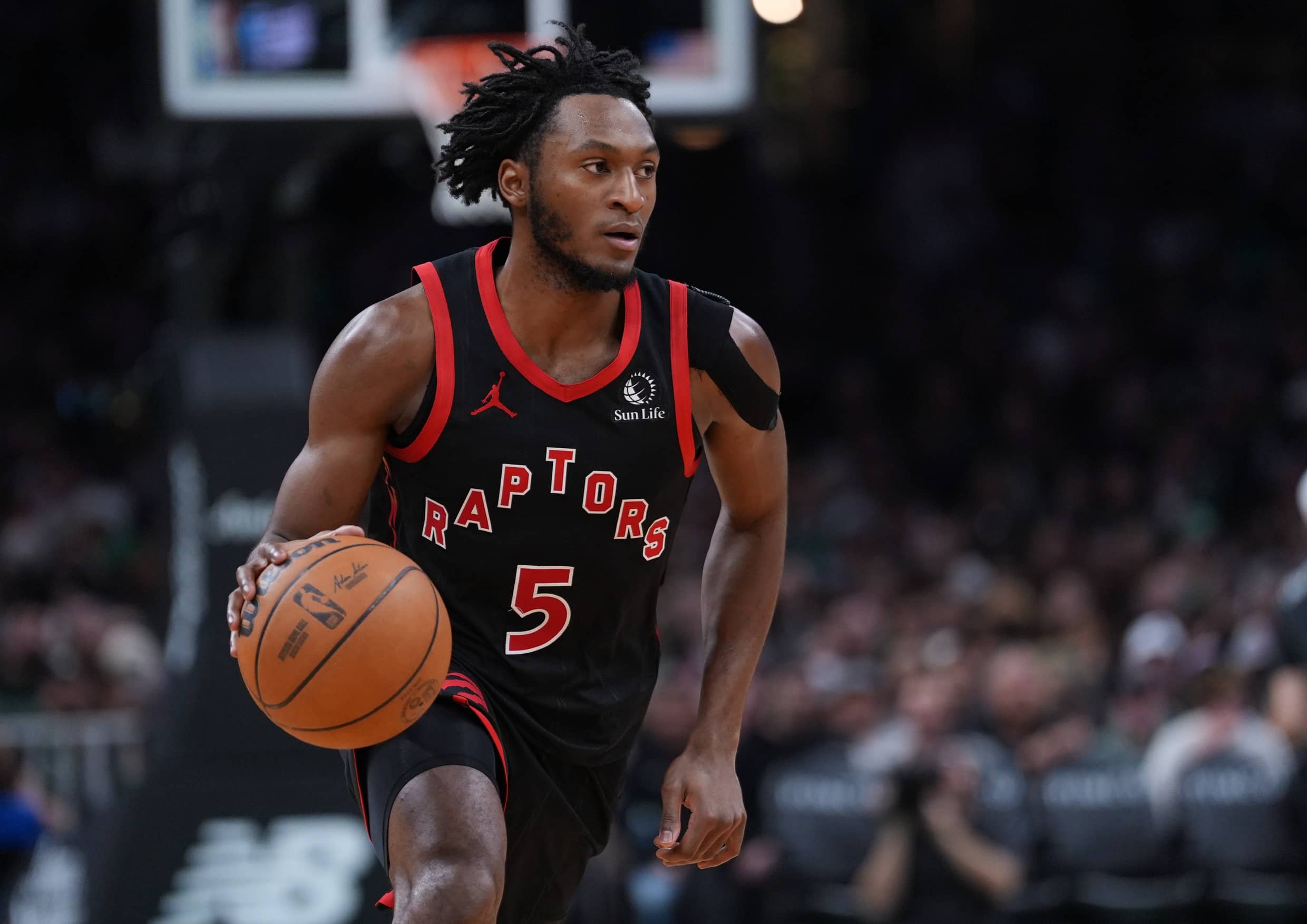 Jan 9, 2026; Boston, Massachusetts, USA; Toronto Raptors guard Immanuel Quickley (5) returns the ball against the Boston Celtics in the second half at TD Garden. Mandatory Credit: David Butler II-Imagn Images