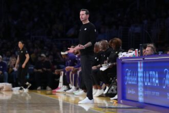 Jan 15, 2026; Los Angeles, California, USA; Los Angeles Lakers head coach JJ Redick reacts against the Charlotte Hornets in the second half at Crypto.com Arena. Mandatory Credit: Kirby Lee-Imagn Images
