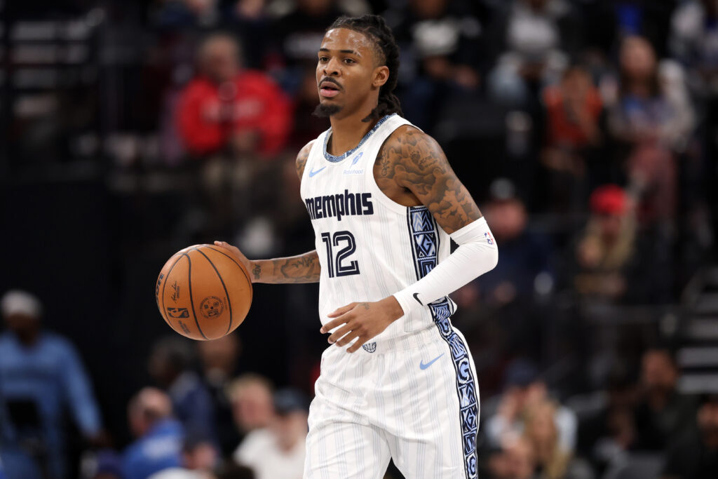 Dec 15, 2025; Inglewood, California, USA; Memphis Grizzlies guard Ja Morant (12) brings the ball up court during the third quarter against the Los Angeles Clippers at Intuit Dome. Mandatory Credit: Kiyoshi Mio-Imagn Images