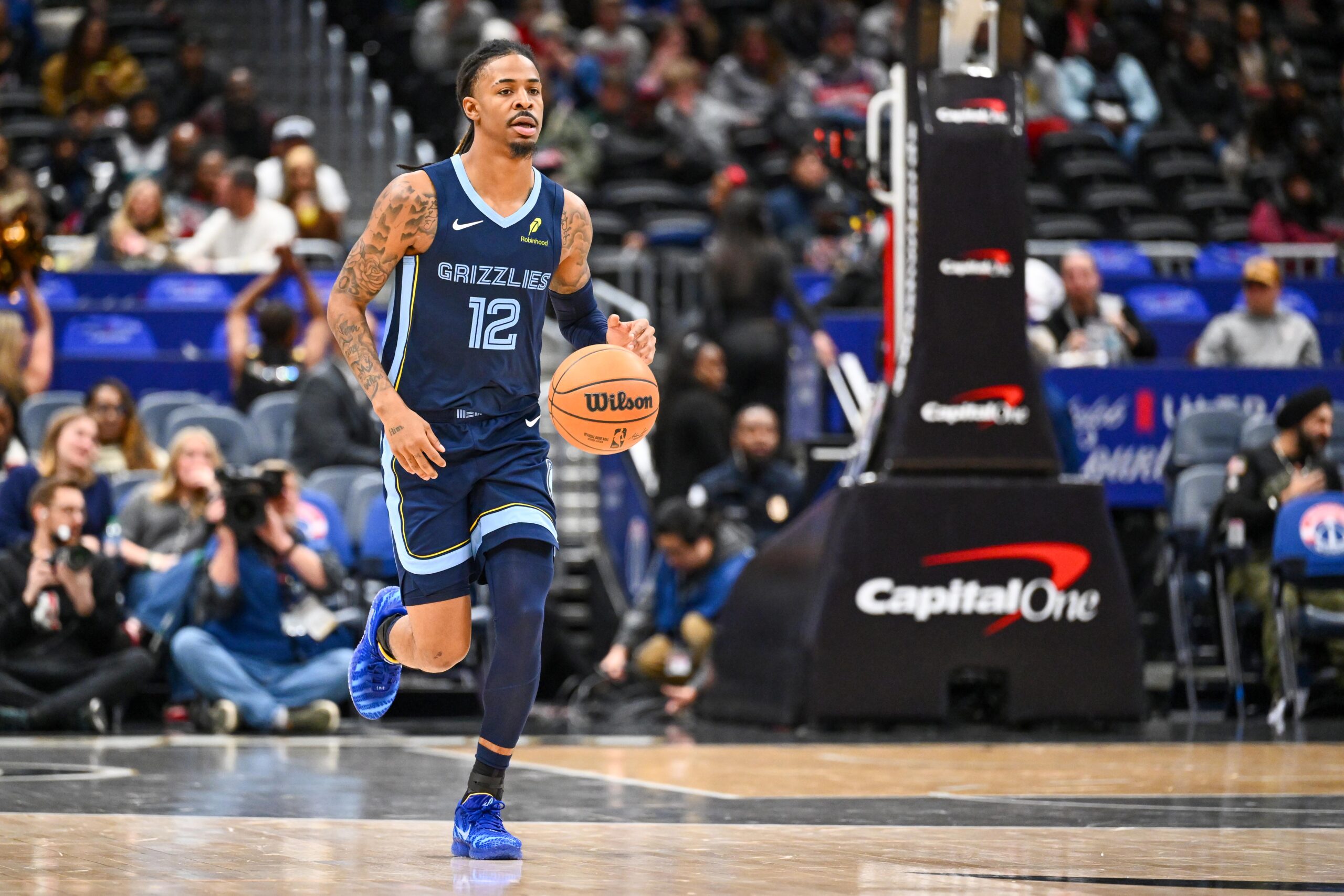 Dec 28, 2025; Washington, District of Columbia, USA; Memphis Grizzlies guard Ja Morant (12) advances the ball against the Washington Wizards during the first half at Capital One Arena. Mandatory Credit: Brad Mills-Imagn Images