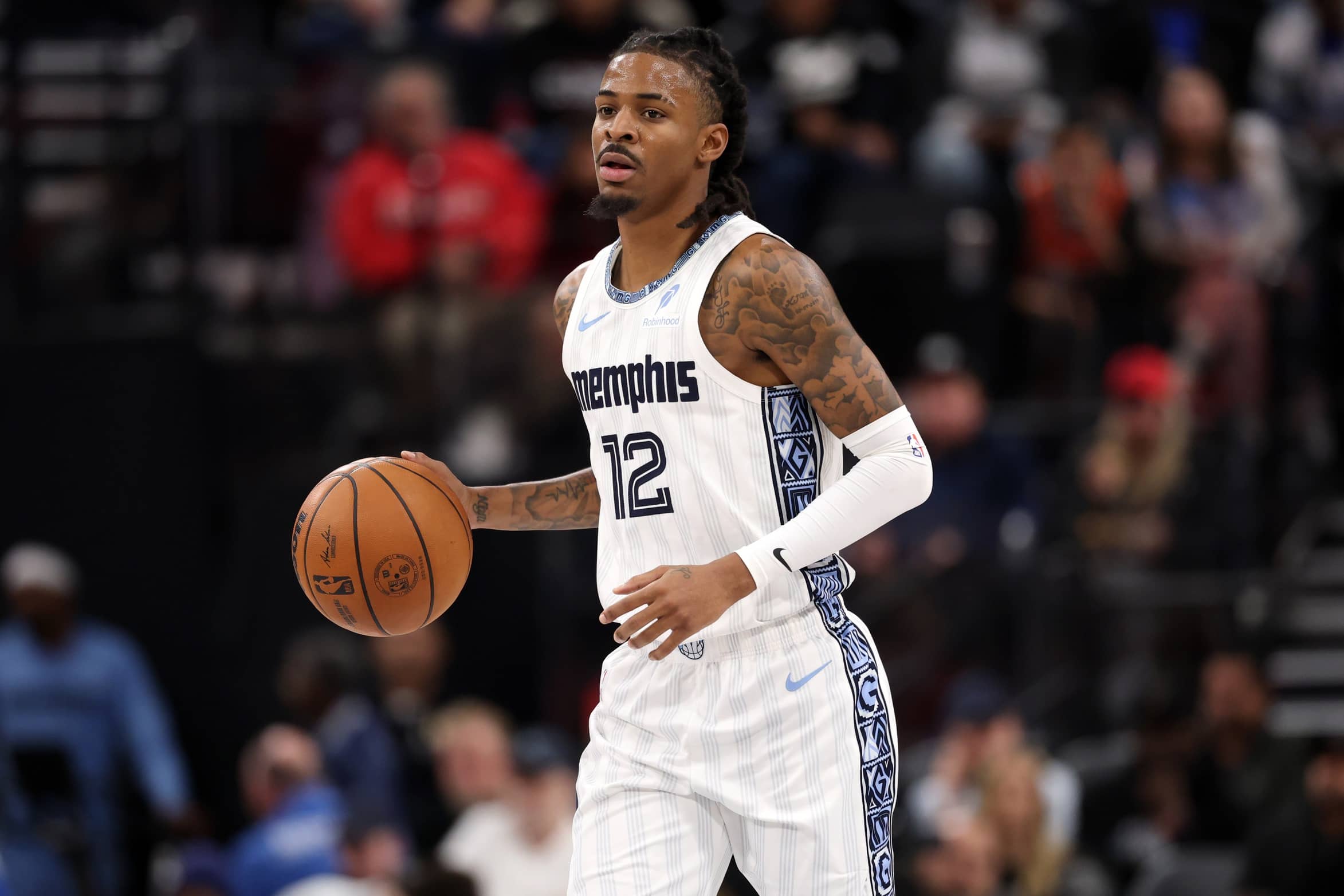 Dec 15, 2025; Inglewood, California, USA; Memphis Grizzlies guard Ja Morant (12) brings the ball up court during the third quarter against the Los Angeles Clippers at Intuit Dome. Mandatory Credit: Kiyoshi Mio-Imagn Images