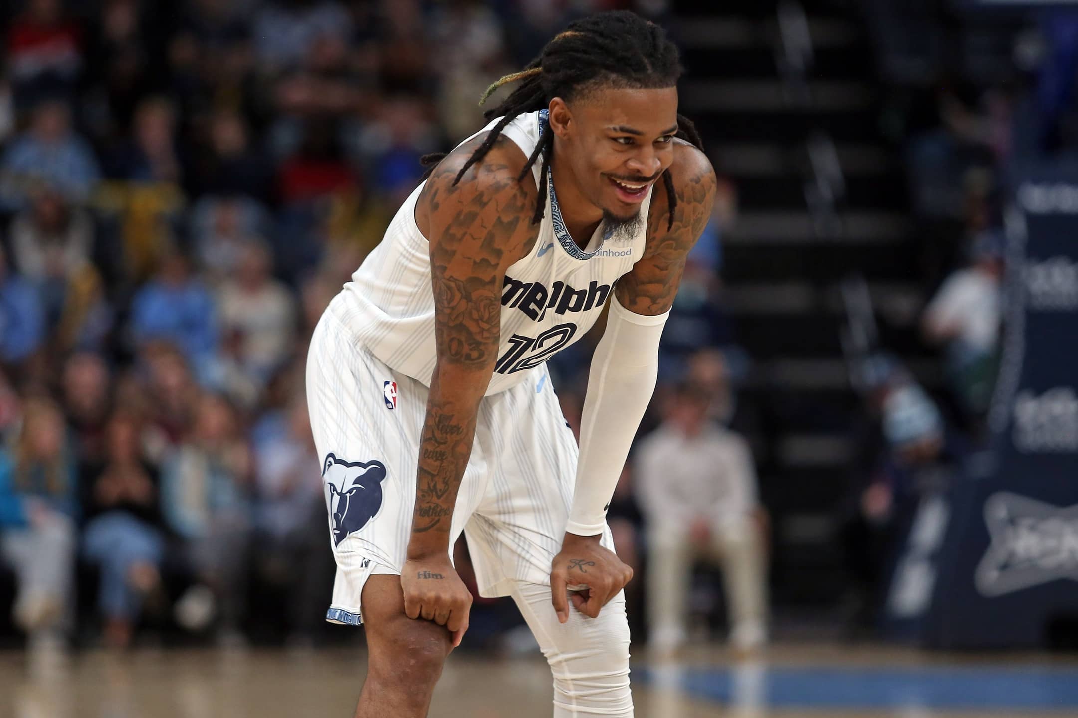 Dec 26, 2025; Memphis, Tennessee, USA; Memphis Grizzlies guard Ja Morant (12) reacts during the second quarter against the Milwaukee Bucks at FedExForum. Mandatory Credit: Petre Thomas-Imagn Images